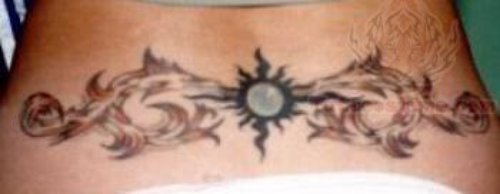 Tribal Sun And Floral  Tattoo On Lowerback